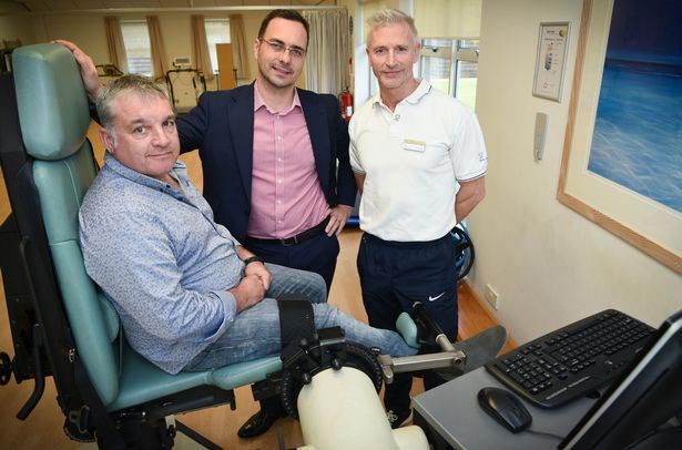 Dad whose legs were paralysed learns to walk again
