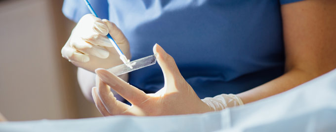 A nurse holding testing aparatus