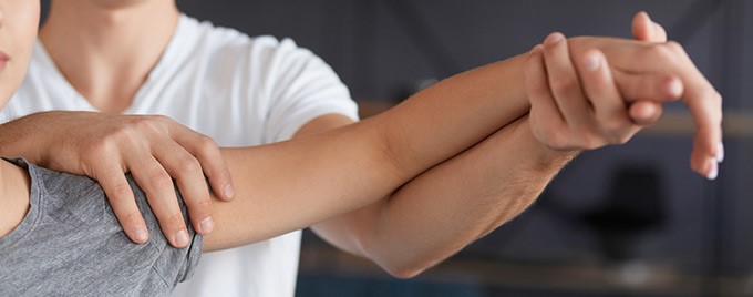 Somebody receiving physiotherapy on their shoulder