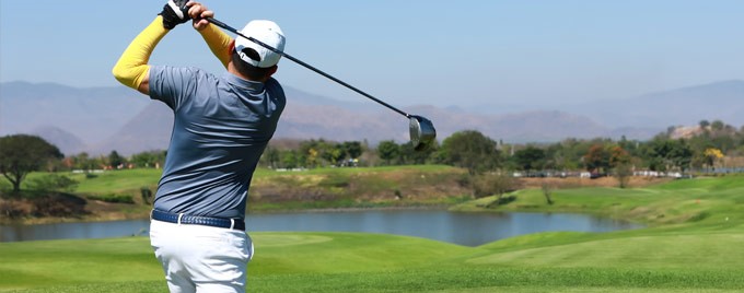 Image of a man playing golf