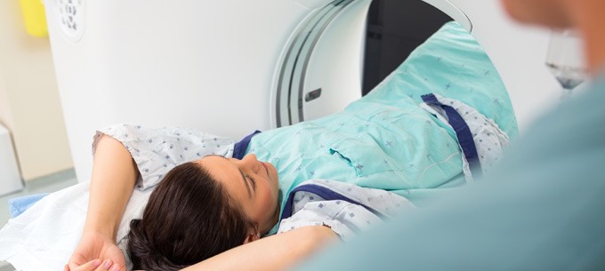 A female patient undergoing a CT scan