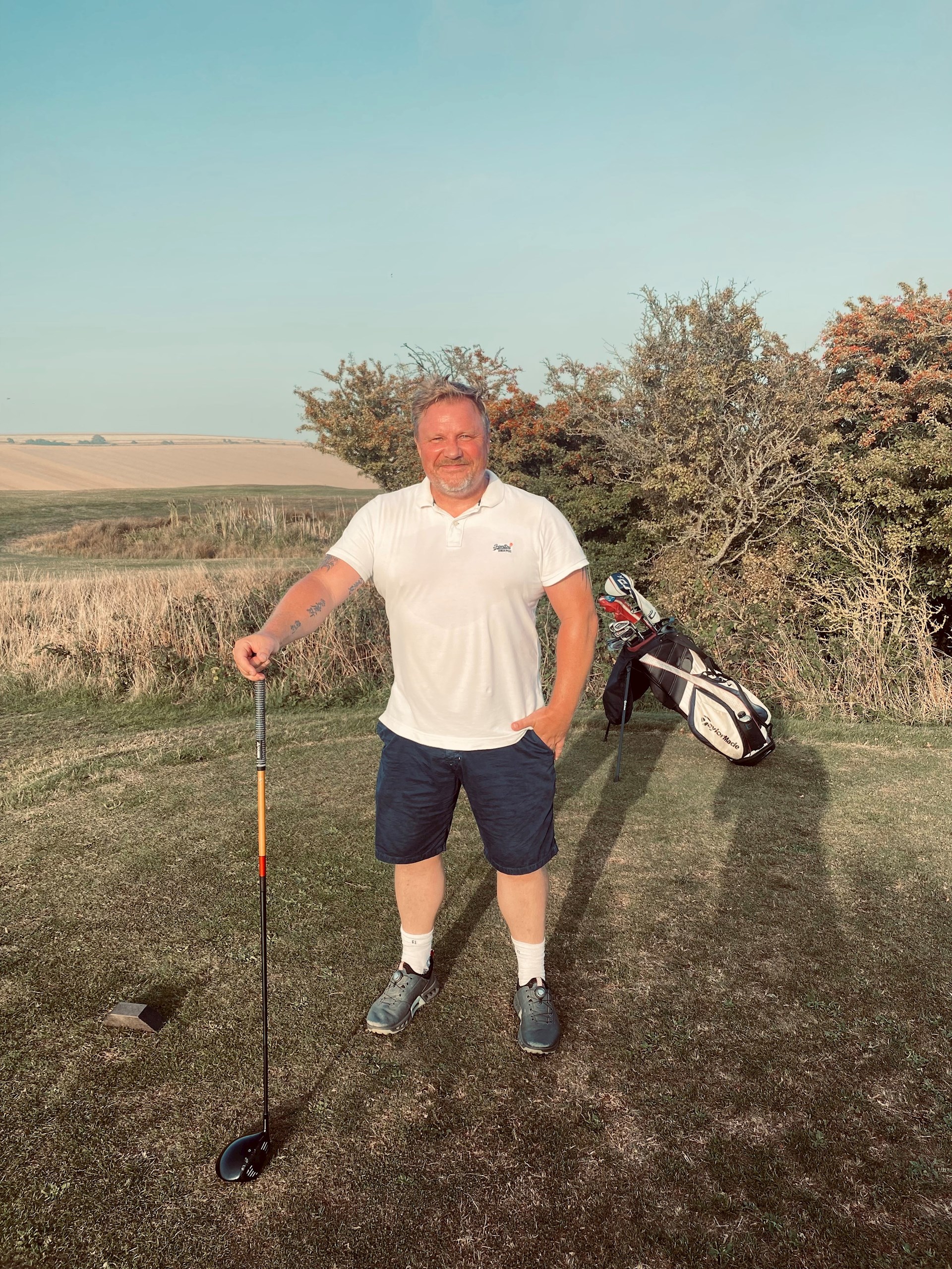 Former firefighter Lee Burridge standing on a golf course after knee replacement surgery at The Montefiore Hospital.