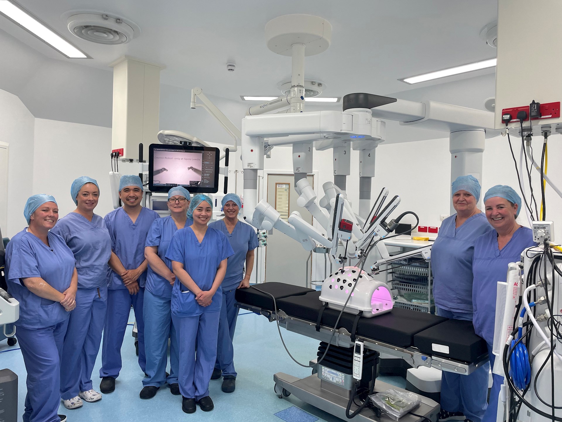 Spire Leeds Hospital theatre team standing with the da Vinci Xi robotic surgery system